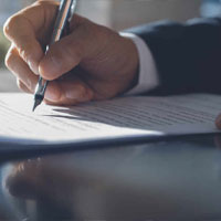 lawyer signing contract